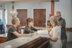 patients talking to employees