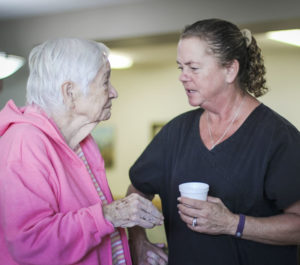 Caretaker talking with paitient at Woodbury